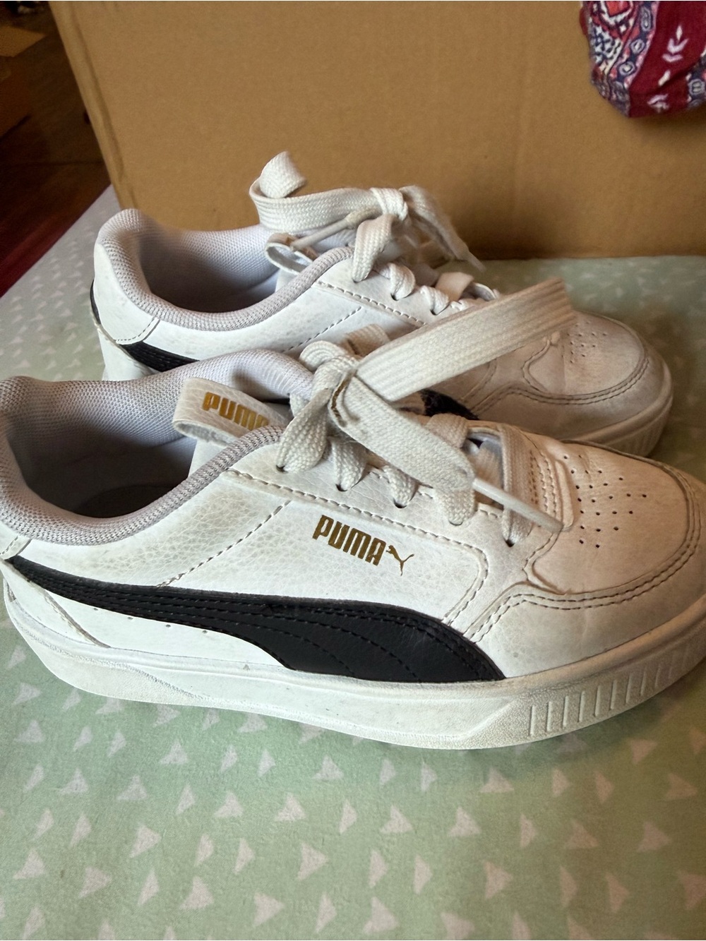 Puma Kids White Sneakers with Black Stripe and Gold Logo